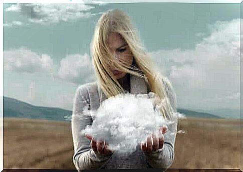 woman holding a cloud in her hands