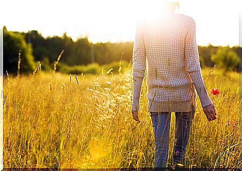 Woman-in-a-field-with-a-poppy-1