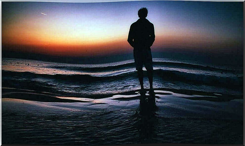 A man alone facing the sea