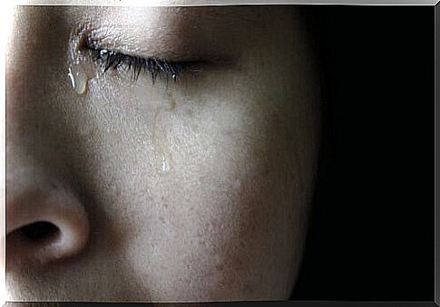 A woman shedding a tear